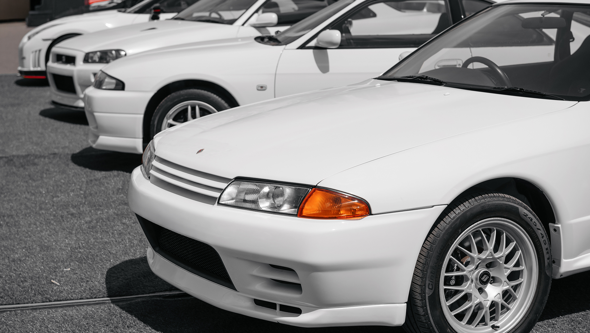 Japanese car auction inspection lanes with vehicles awaiting sale