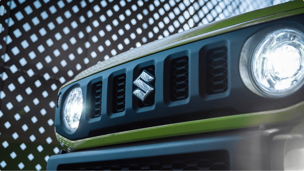 Close up of Suzuki Jimny Sierra front grille and LED headlights showing retro inspired Japanese 4WD styling