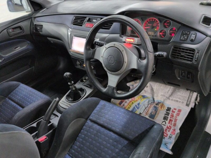 Mitsubishi Lancer Evolution VIII GSR driver cockpit black blue interior