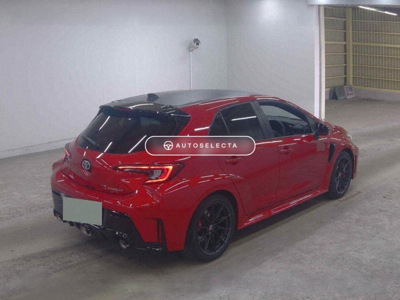 Toyota GR Corolla RZ rear three quarter view Deep Red